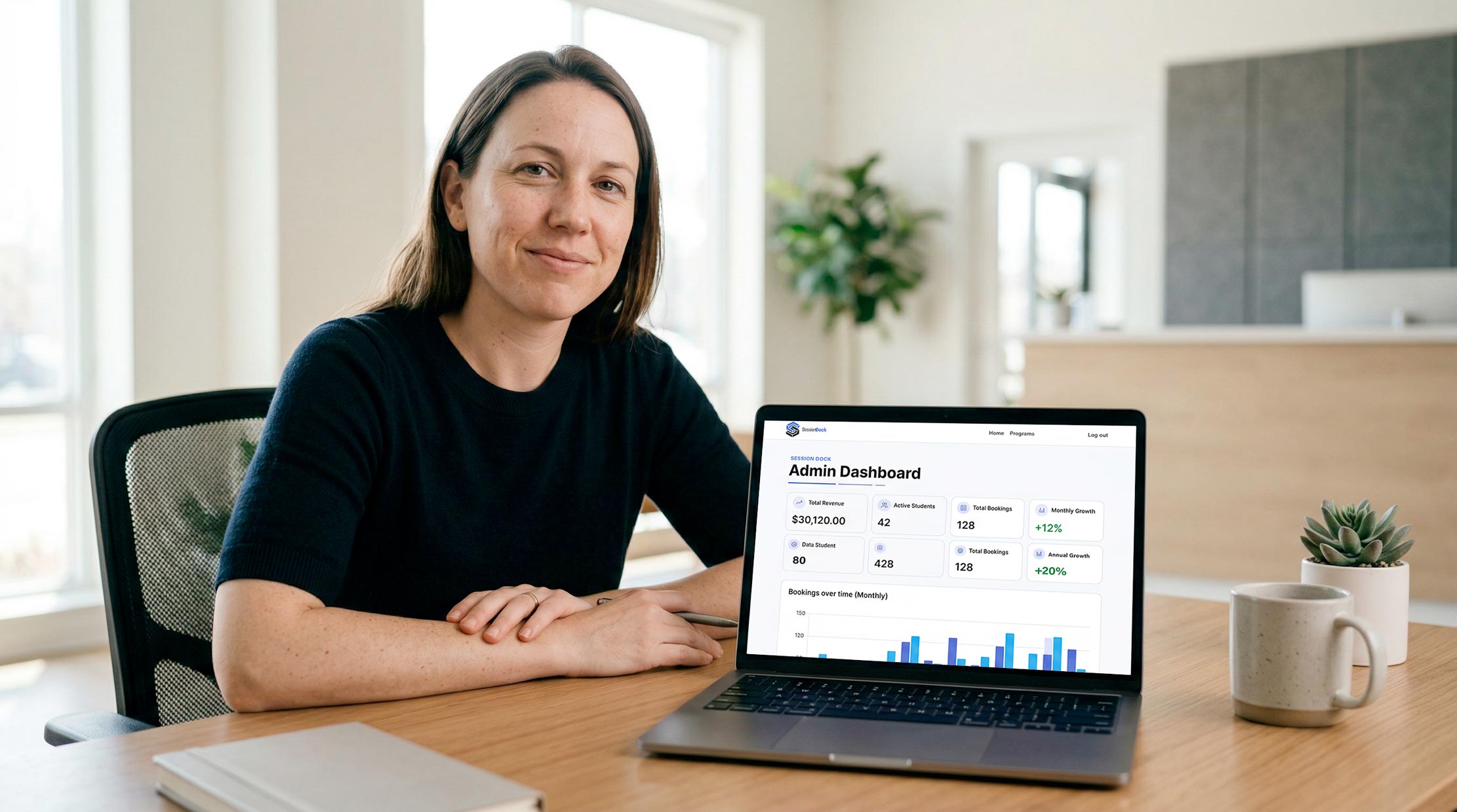 Business owner viewing SessionDock admin dashboard on laptop